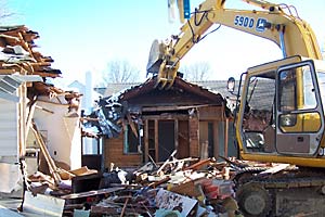 Home demolition using John Deere 5900 excavator